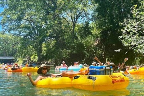 a group of people floating down a river