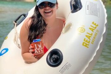 a person standing with an innertube around her