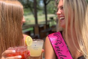 two women with drinks in their hands