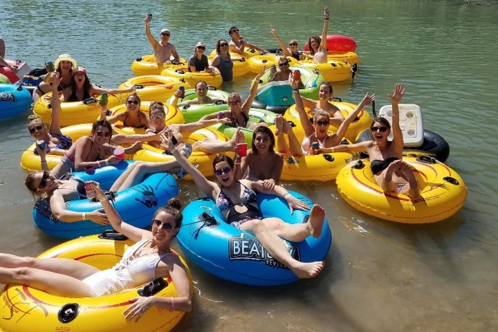 a group of people on a raft in a body of water