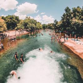 several people in and around a river