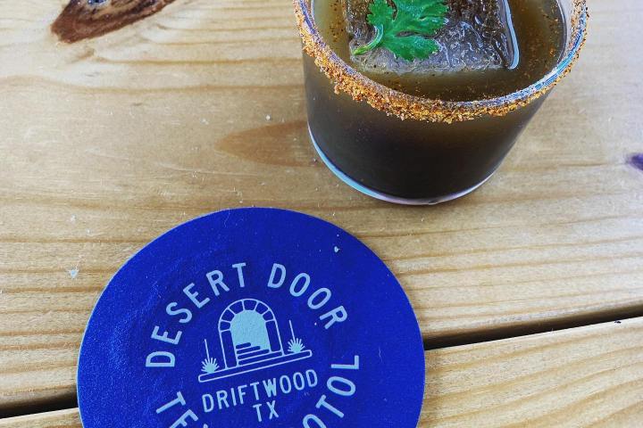 a cocktail sitting on a wood table