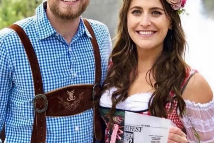 a man and woman in traditional German clothes