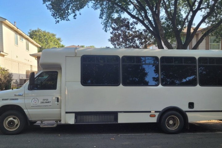 a truck is parked in front of a bus