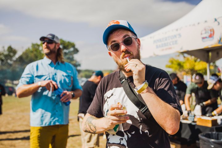 a person holding a sandwich