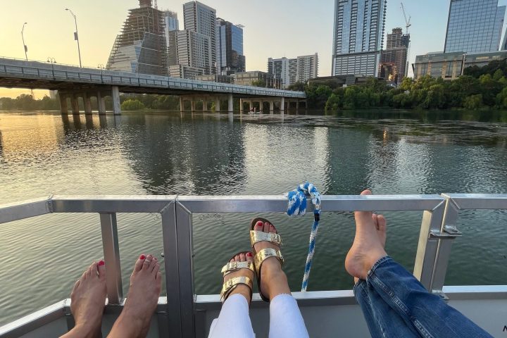 a group of people on a bridge over a body of water